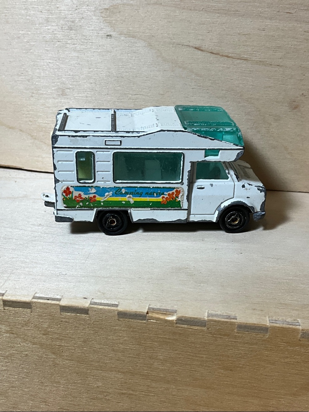 White & Teal Toy Camper Van with Floral Graphics